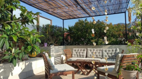 Chambre calme ouvrant sur magnifique rooftop